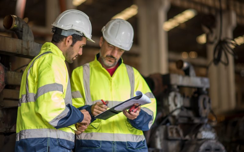 Industry engineer worker at factory. Engineer assembling industrial gearbox in engineering factory
